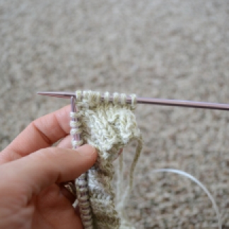 Knit in back of stitch and pull off the needle